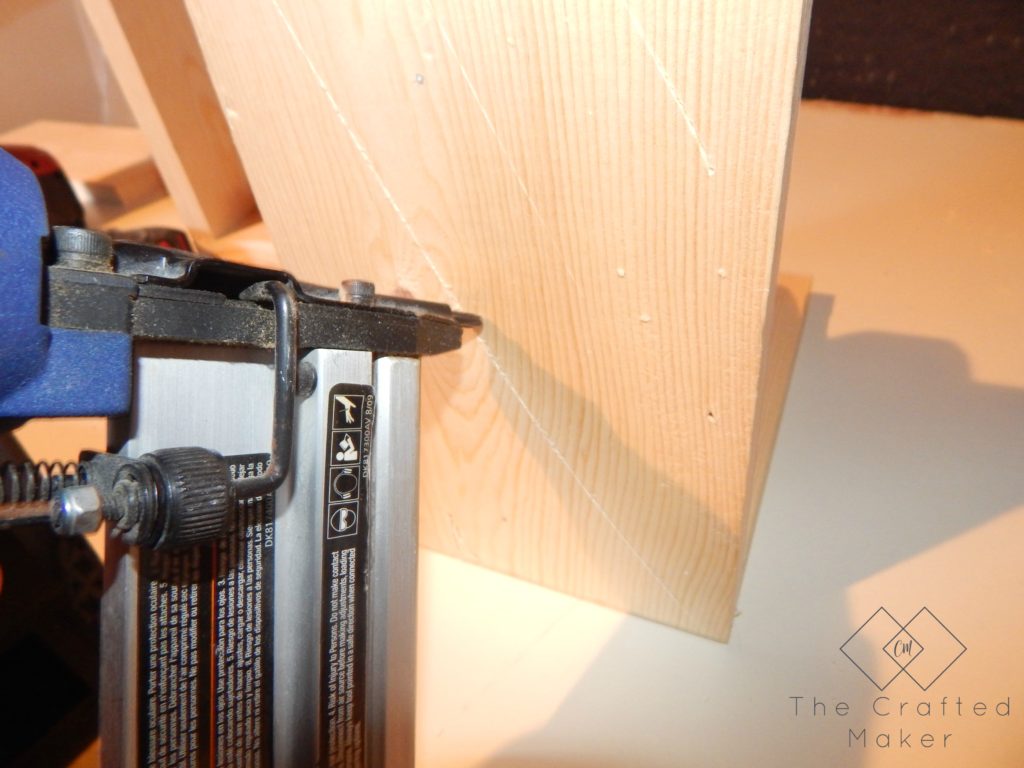 Nailing the Brackets from the back for the DIY Wood Bookends - The Crafted Maker