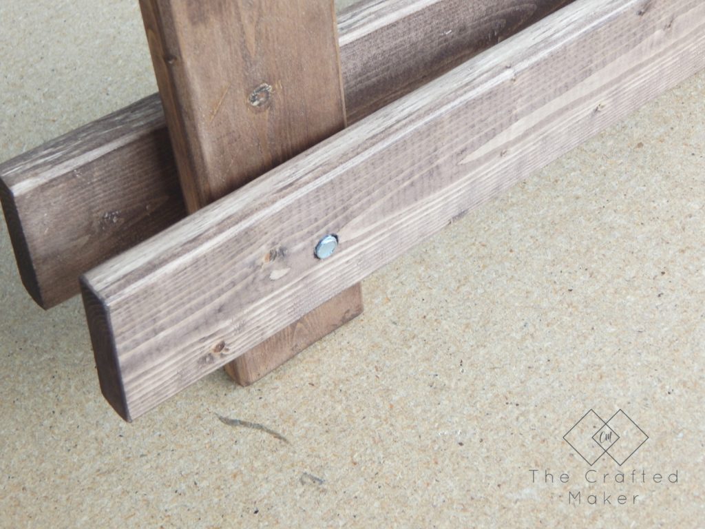 Build this DIY Arhaus inspired end table! Easy build with just a few sizes of wood and nuts and bolts. Great weekend project. Includes free PDF plans!