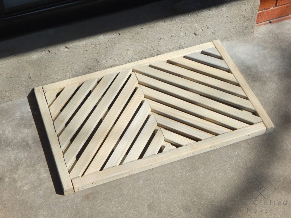 If you have ever wanted to make your own DIY wooden doormat, this is for you. With just a few boards, give your front porch a makeover.