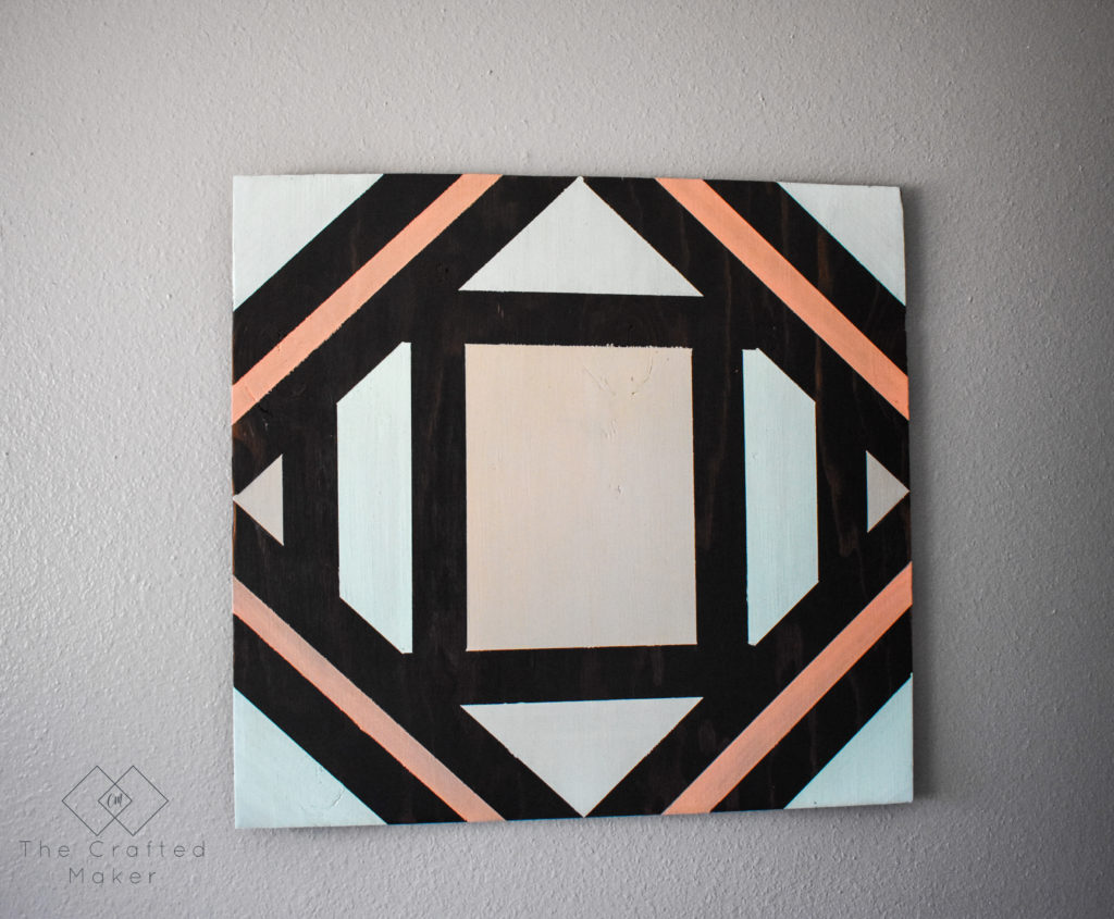 Make this fun geometric scrap wood wall art with scrap wood and paint you already have on hand. This is a quick, colorful, and creative afternoon project!