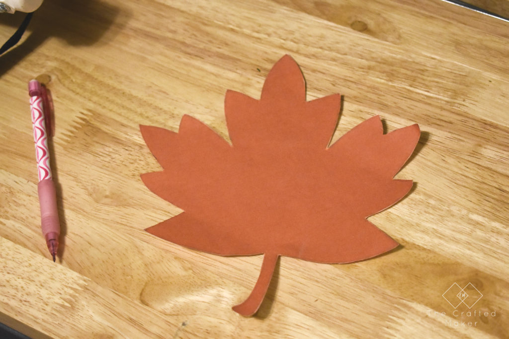 Fall is finally here and it's time to decorate accordingly. Make this quick, easy, and adorable Fall leaf door hanger with scrap wood you already have!