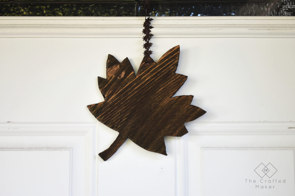 Fall is finally here and it's time to decorate accordingly. Make this quick, easy, and adorable Fall leaf door hanger with scrap wood you already have!