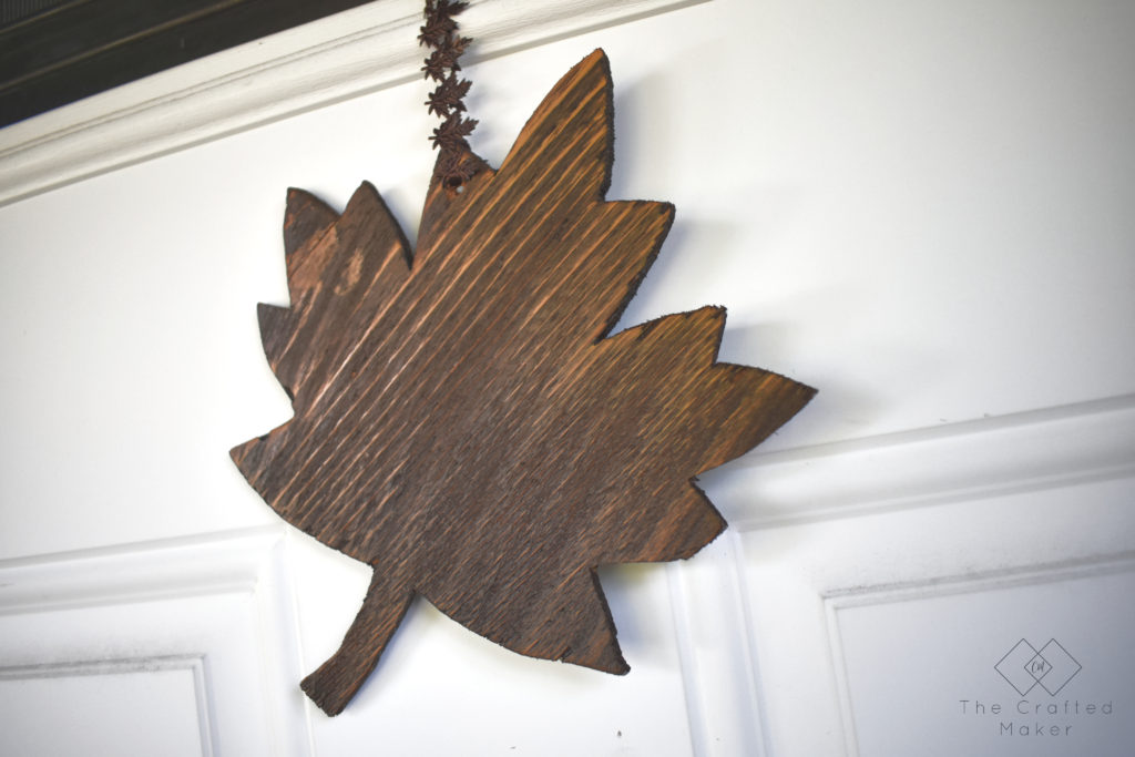 Fall is finally here and it's time to decorate accordingly. Make this quick, easy, and adorable Fall leaf door hanger with scrap wood you already have!