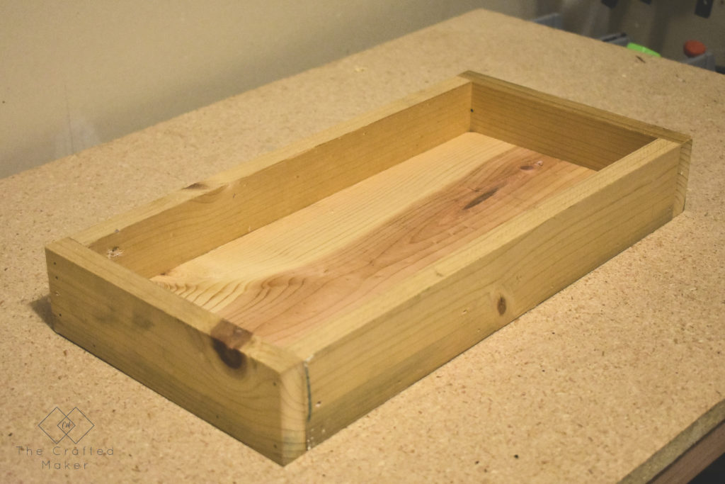 A wooden tray is a staple in home decor. It not only looks good mixed in with decor but serves a purpose too! Build this simple wooden try in about an hour.
